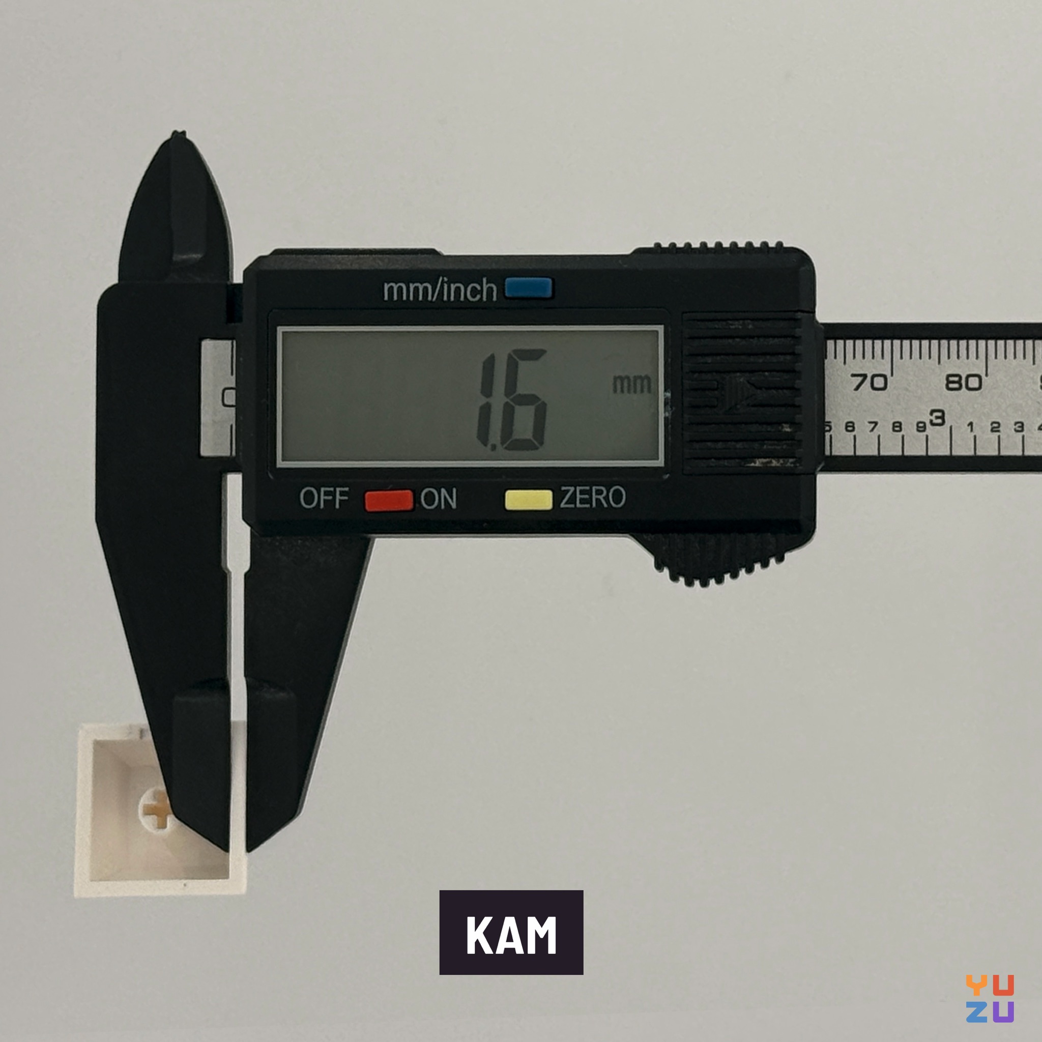Caliper measuring the wall thickness of KAM keycaps