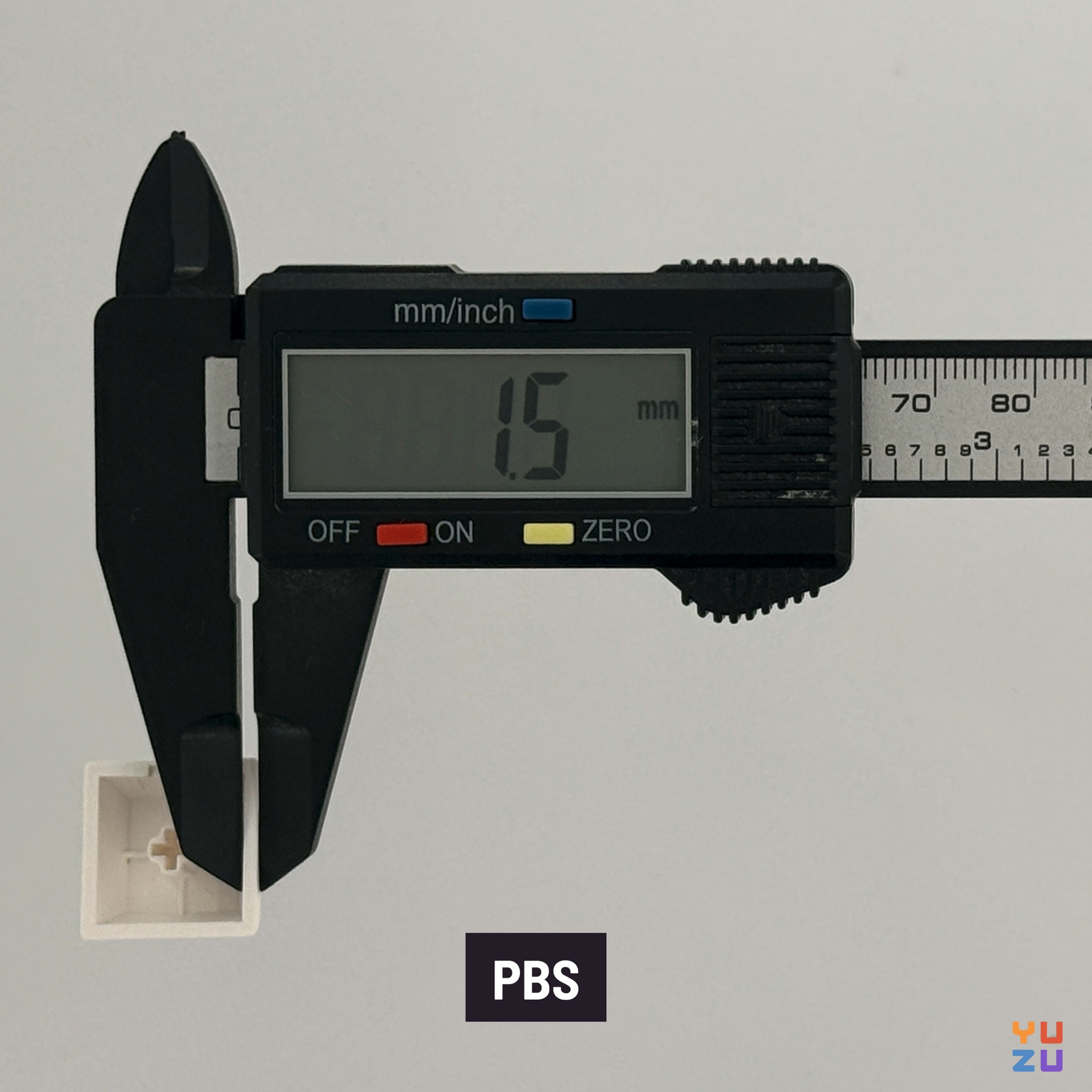 Caliper measuring the wall thickness of PBS keycaps
